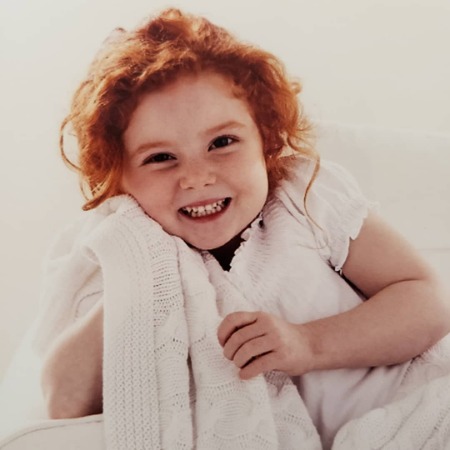 Francesca Capaldi childhood picture with her happy face.